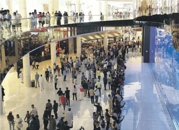  ?? Pawan Singh / The National ?? Shoppers from neighbouri­ng Gulf countries were among the ranks of the bargain hunters at Dubai Mall as the Eid sales got under way