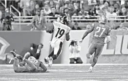  ?? AP Photo/Rick Osentoski ?? Pittsburgh Steelers wide receiver JuJu Smith-Schuster (19) breaks downfield for a 97-yard touchdown run Sunday during the second half against the Detroit Lions in Detroit.