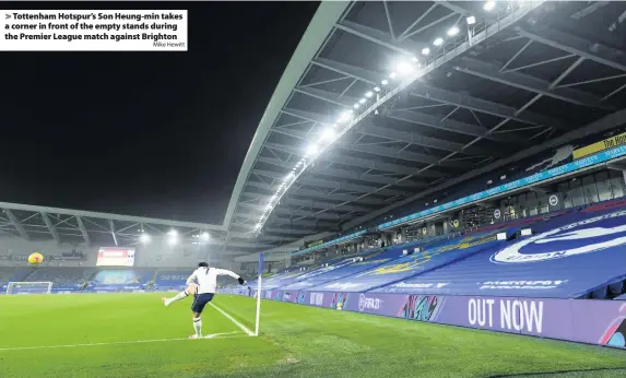  ?? Mike Hewitt ?? Tottenham Hotspur’s Son Heung-min takes a corner in front of the empty stands during the Premier League match against Brighton