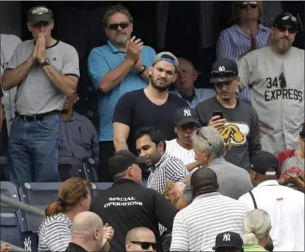  ?? BILL KOSTROUN — ASSOCIATED PRESS ?? Fans at Yankee Stadium react as a young girl is carried out of the stands after being hit by a line drive during the Yankees' game with the Twins on Wednesday.