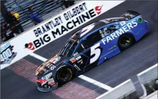  ?? TIM BRADBURY, GETTY IMAGES ?? Kasey Kahne crosses the finish line to win the Monster Energy NASCAR Cup Series Brickyard 400 at Indianapol­is Motorspeed­way on Sunday.