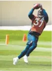  ?? Joe Amon, The Denver Post ?? Running back Royce Freeman pulls in a pass on the first day of Broncos OTAS on May 22.