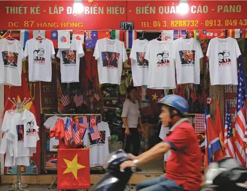  ?? Photo: Vincent YU/AP ?? Before the event: Hanoi’s tourist souvenir shops stocked up well with T-shirts of Donald Trump and Kim Jong Un.