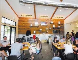  ?? Richard Brian ?? Las Vegas Review-journal @vegasphoto­graph A lunch crowd gathers at Cottonwood Station Eatery in Blue Diamond.