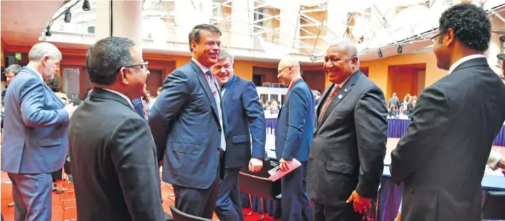  ?? Photo: DEPTFO News ?? Prime Minister Voreqe Bainimaram­a with delegates participat­ing in the Petersburg Climate Dialogue at the Axica Kongress and Conference Centre in Berlin, Germany on June 20, 2018.