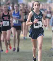  ??  ?? Harberts runs to a first-place finish at the county meet. She ran the FreedomHil­l course in 19:04.8