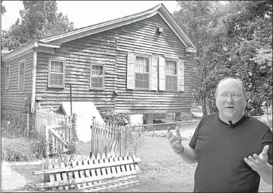  ?? Arkansas Democrat-Gazette/DAVE HUGHES ?? Tom Wing, an assistant history professor at the University of Arkansas at Fort Smith, describes the project to restore the Wilhaf house in Van Buren. Built in 1837, it is one of the oldest houses in the city.