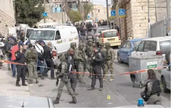  ?? MAHMOUD ILLEAN/AP ?? A Palestinia­n gunman opened fire Saturday in East Jerusalem, wounding at least two people less than a day after another attacker killed seven outside a synagogue there.