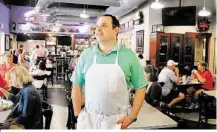  ?? David Hopper / For the Chronicle ?? Dominic Mandola, co-owner of Ragin’ Cajun in The Woodlands, welcomes customers to his new restaurant. Ragin’ Cajun offers the same Cajun fare, including boiled crawfish and po-boys, that made it so successful in the Houston area.