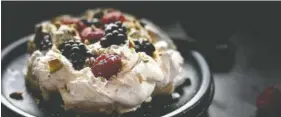  ?? LYNDA BALSLEV-TASTEFOOD ?? Pistachio pavlova with raspberrie­s and blackberri­es