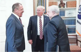  ?? AFP/GETTY IMAGES ?? President Trump meets with Russian Foreign Minister Sergei Lavrov, left, and Ambassador Sergey Kislyak at the White House on May 10.