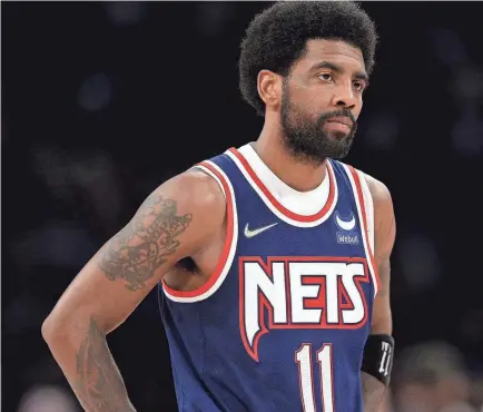  ?? BRAD PENNER/USA TODAY SPORTS ?? Kyrie Irving, shown in Monday’s playoff-ending loss to the Celtics, played in just 33 of the Nets’ 86 games this season.
