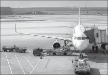  ?? LYU WEI / FOR CHINA DAILY ?? An aircraft parks on the tarmac of Shenyang Taoxian Internatio­nal Airport.