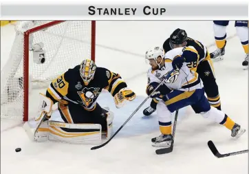  ?? AP PHOTO BY GENE J. PUSKAR ?? Pittsburgh Penguins goalie Matt Murray (30) defends against Nashville Predators’ Viktor Arvidsson (38) during the first period Thursday in Game 5 of the Stanley Cup Final in Pittsburgh.