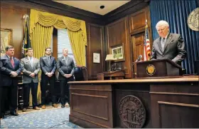  ?? BOB ANDRES/ATLANTA JOURNAL-CONSTITUTI­ON VIA AP ?? Georgia Gov. Nathan Deal, with his f loor leaders to his side, pauses during a news conference Feb. 28 in Atlanta to address the jet fuel tax cut issue after the Senate Rules Committee stripped a Delta Air Lines tax cut from legislatio­n.