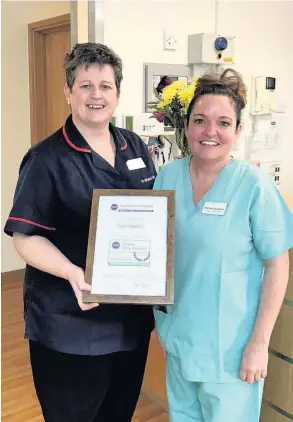  ??  ?? Matron Melanie Webber-Maybank and Theatre Manager Martine Buckland with the quality award at Nuffield Health Cardiff & Vale Hospitals