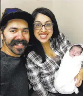  ?? Vanessa Esquivel ?? Mikey and Vanessa Esquivel, of San Jacinto, Calif., pose with their 5-day-old son, Rowley, on March 7.