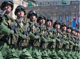  ??  ?? Russian soldiers march during a rehearsal for the Victory Day military parade in Red Square, Moscow, on Sunday. The parade will take place in in Red Square on Tuesday to celebrate 72 years since the end of WWII and the defeat of Nazi Germany.