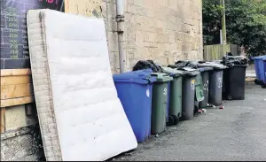  ??  ?? Eyesore Old mattresses, overflowin­g bins, discarded household furniture and piles of b lack bin bags are all too evident on the streets of Paisley’s west end