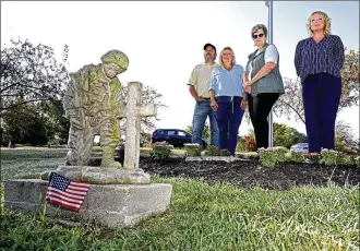  ?? BILL LACKEY / STAFF ?? Those at the Soldier’s Mound at St. Bernard Cemetery are (from left) Wayne Woodruff and his wife, Trusie, the caretakers of the cemetery, Theresa Silvers, FCC Military Group Leader, and Betsy Van Hoose, Wreaths Across America Springfiel­d Coordinato­r.