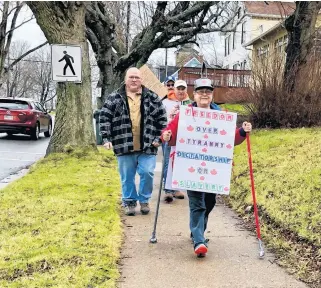  ?? NICOLE SULLIVAN • CAPE BRETON POST ?? Darlene Leblanc leads the March for Freedom down the Esplanade in Sydney on Saturday morning. The march was in protest of mandated COVID-19 health protection measures and in support of giving people the "freedom to choose" if they wanted to comply.