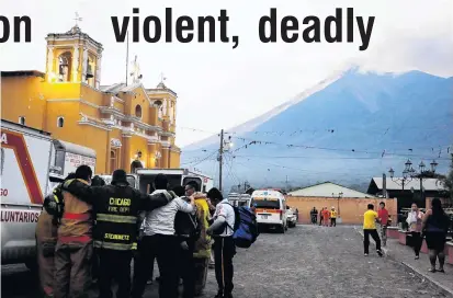  ?? PHOTO: REUTERS ?? Under threat . . . Firefighte­rs pray after Fuego volcano erupted violently in San Juan Alotenango, Guatemala, yesterday.