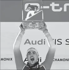  ?? AFP ?? Switzerlan­d's Daniel Yule celebrates on the podium after an improbable victory in the men's slalom event during the FIS Alpine ski World Cup in Chamonix, France, on Sunday.