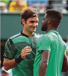  ?? AFP PIC ?? Roger Federer (left) celebrates after defeating Frances Tiafoe in the Miami Open on Saturday. Federer won 7-6 (7-2), 6-3.