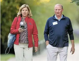  ?? /Kevin Dietsch/Getty Images ?? Power walk: Greg Abel, vice-chairman of Berkshire Hathaway’s noninsuran­ce assets, and Andrea Abel walk to a morning session at the Allen & Company Sun Valley Conference in this file photo. The vice-chairman received a $1m pay increase..