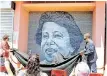  ?? AYANDA NDAMANE African News Agency (ANA) ?? DULCIE September’s niece and nephew Nicola and Michael Arendse unveil an iconic mural celebratin­g the life of their aunt, who was murdered in Paris in 1988. |