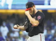  ?? Sean M. Haffey / Getty Images ?? Nationals pitcher Stephen Strasburg takes a 1.32 career postseason ERA to the mound in Game 3.