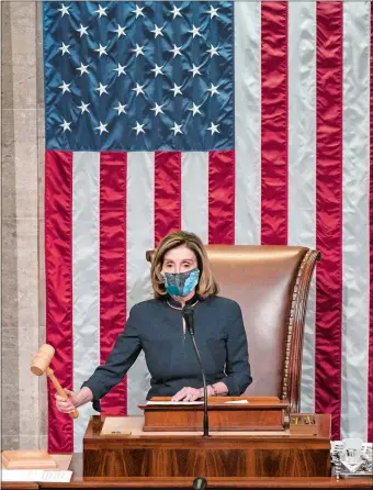  ?? J. SCOTT APPLEWHITE/AP PHOTO ?? Speaker of the House Nancy Pelosi, D-Calif., leads the final vote of the impeachmen­t of President Donald Trump on Wednesday for his role in inciting an angry mob to storm the Capitol last week.