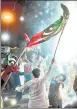  ?? AFP ?? PPP supporters celebrate on the street after the Supreme Court ruling, in Karachi.