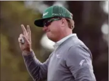  ?? DAVID GOLDMAN — THE ASSOCIATED PRESS ?? Leader Charley Hoffman waves after round with a 65. finishing the first