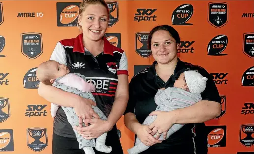  ??  ?? North Harbour’s Becky Wood, left, and Waikato’s Sosoli Talawadua have their recently born babies for company at the launch of the provincial rugby season yesterday. PHOTOSPORT