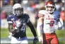  ?? Stephen Dunn / Associated Press ?? UConn running back Kevin Mensah (34) gains yardage against Houston linebacker Jordan Carmouche (8) during the second half on Saturday in East Hartford.