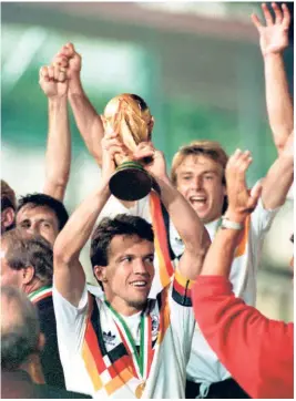  ?? THE HINDU PHOTO LIBRARY ?? World Cup glory: Lothar Matthaeus lifts the World Cup after West Germany’s victory over Argentina in the 1990 final in Rome.