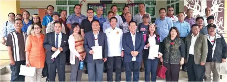  ??  ?? Dennis (front row, centre), Baru (front row, fifth right), Elizabeth (front row, third right) and others in a photo call after the presentati­on of appointmen­t certificat­es.