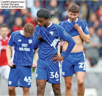  ?? ?? Cardiff’s players react to their five-goal defeat at Rotherham