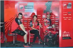  ?? ?? SEPANG: Ducati Italian rider Francesco Bagnaia (R) sits beside team members K\YPUN [OL ÄYZ[ KH` VM [OL WYL ZLHZVU 4V[V.7 [LZ[ H[ [OL :LWHUN 0U[LYUH[PVUHS Circuit in Sepang on February 6, 2024. — AFP