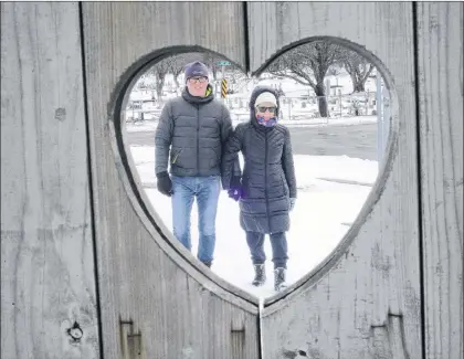  ?? JOE GIBBONS/THE TELEGRAM ?? Folk singer Ron Kelly and his wife of 45 years, Patsy, walk around Quidi Vidi Lake on Valentine’s Day, Thursday. Ron, from Joe Batt’s Arm, and Patsy, from Fogo Island, now live in St. John’s. Among his popular songs are “Home” and “Joe Batt’s Arm Longliner.”