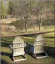  ?? PHOTO BY PAM BAXTER ?? A pair of Adirondack chairs invite visitors to enjoy the view of the pond at Jenkins Arboretum.