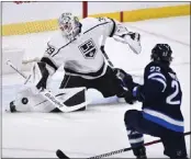  ?? FRED GREENSLADE — THE CANADIAN PRESS VIA AP ?? Kings goaltender Cam Talbot makes a save on a shot by Winnipeg’s Mason Appleton during Tuesday’s victory.