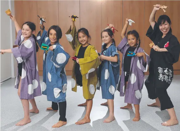  ?? Picture: GLENN HAMPSON ?? Teiko Fujita is teaching traditiona­l Japanese dance to children at the Helensvale Community Centre. Her students include (from left) Tiffany Johnson, 9, Kaiki Wabo, 8, Leela Hodgkins, 8, Melissa Skelton, 8, and Nahmi Power, 6.