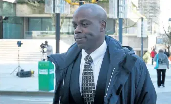  ?? THE CANADIAN PRESS FILES ?? RCMP Const. Kwesi Millington leaves court during a lunch break at his perjury trial in Vancouver, B.C., on Monday March 10, 2014. The Supreme Court of Canada announced Thursday it will hear an appeal from Millington.