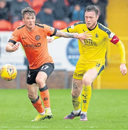  ?? Picture: SNS Group. ?? Jordan McGhee in action for Falkirk against Dundee United’s Jamie Robson.