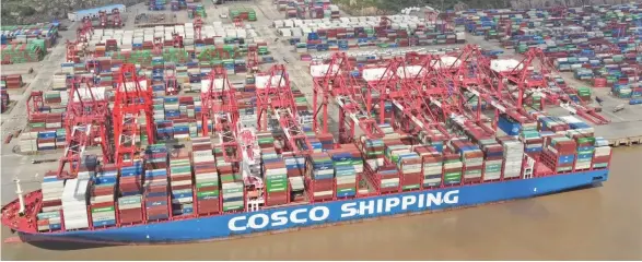  ?? Picture: cnsphoto via Reuters. ?? A Cosco Shipping container ship seen at the Yangshan Deep Water Port in Shanghai on April 24, 2022.