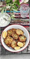  ?? MANJA WACHSMUTH ?? Clockwise from main: Grilled marinated lamb skewers, courgette &amp; feta fritters with tzatziki, tomato &amp; herb couscous.