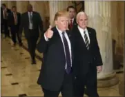  ?? THE ASSOCIATED PRESS ?? President Donald Trump gives a thumbs up as he walkswith Vice President Mike Pence as he departs Capitol Hill in Washington, Thursday, Nov. 16, 2017. Trump urged House Republican­s Thursday to approve a near $1.5 trillion tax overhaul as the party...