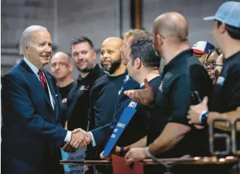  ?? AP ?? President Joe Biden greets audience members Thursday at a steamfitte­rs union hall in Springfiel­d, Virginia.